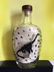 Dinasaur Bottle sculpture by James Prez