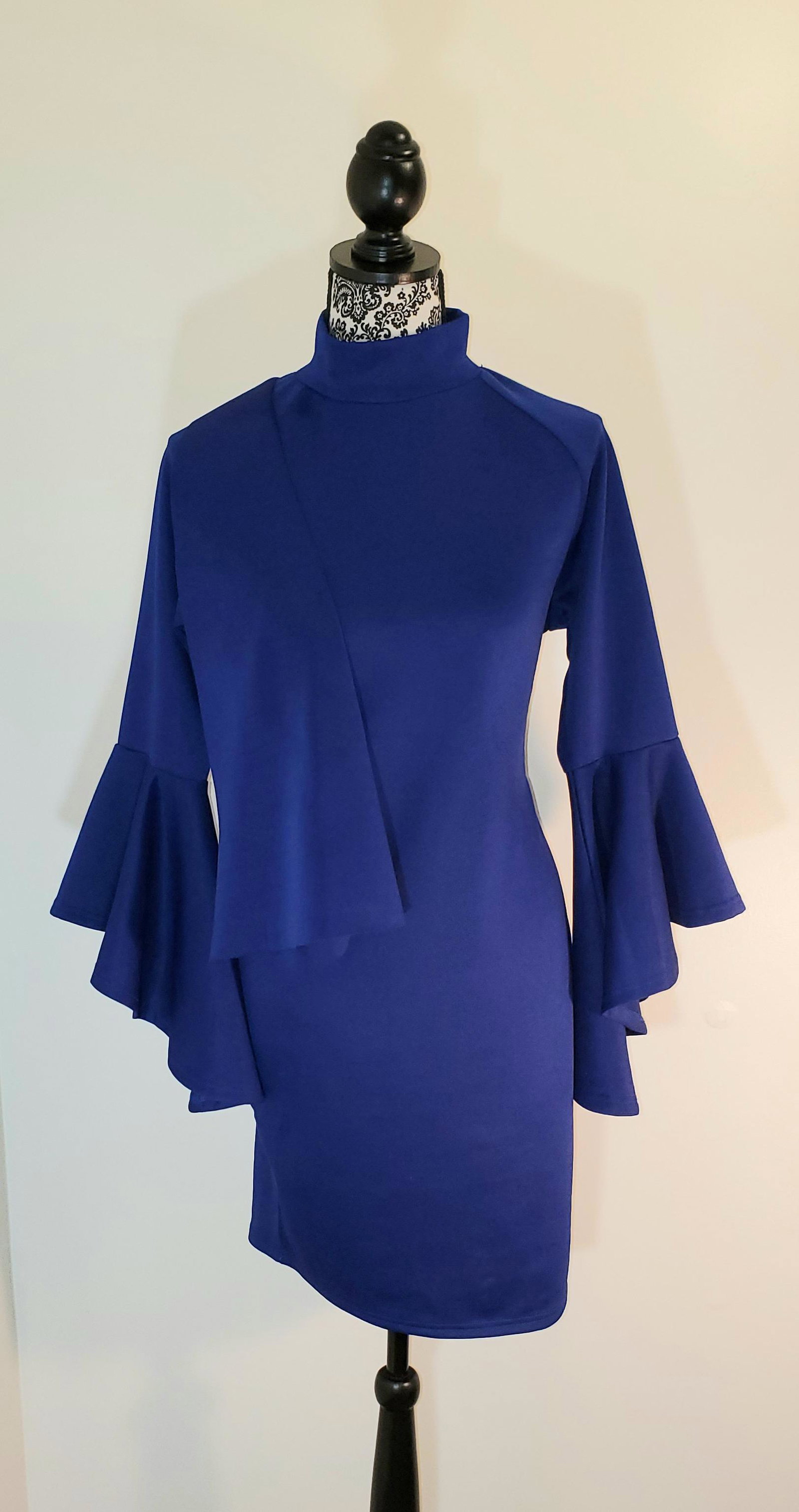 Blue Knit Cocktail Dress: Blue Stretch Knit Cocktail Dress with Front Ruffle Accent and Wizard sleeves detailing. Size M (but fabric does stretch)