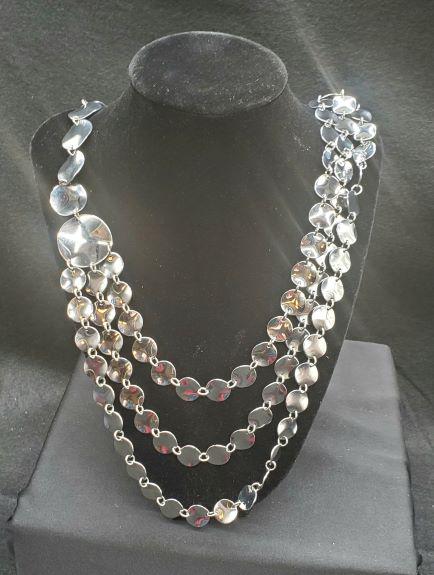 Simone Collini Stainless Steel Necklace: Simone Collini Stainless Steel Necklace. One necklace that branched to 3 elegant layers in the front.