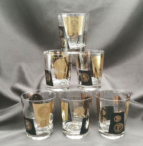 Mid Century Modern: Set of 6 Vintage MCM 60's 22kt gold old coin rocks glasses. This unique design was patterned after old coins from the 1900's from around the world.