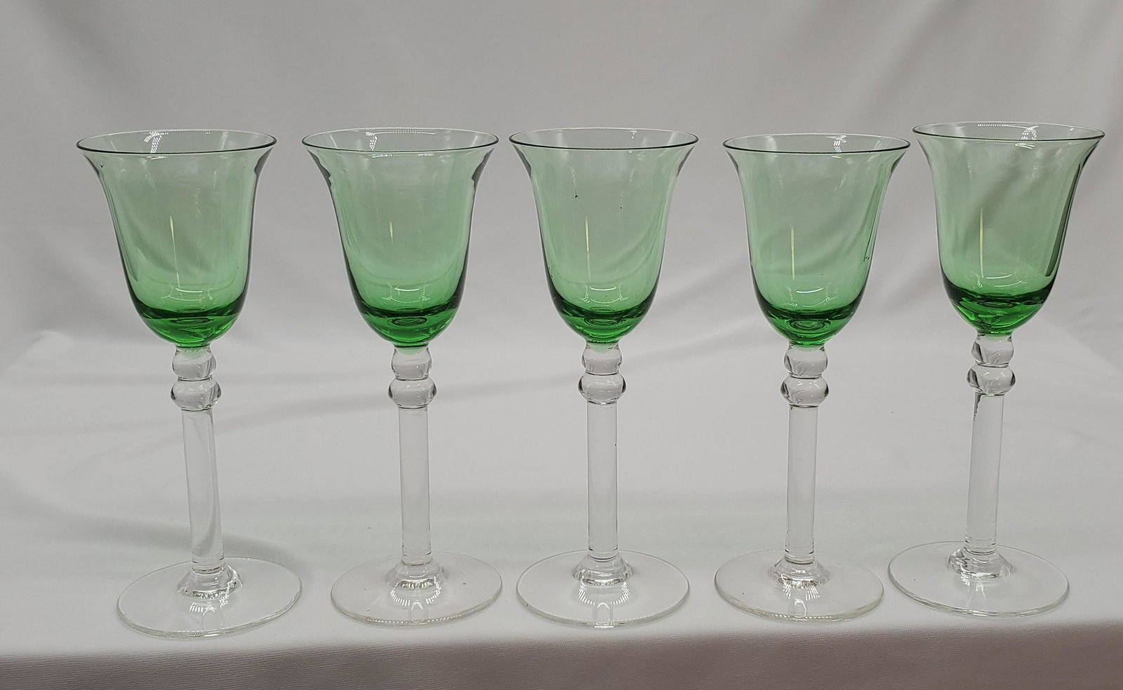 German Cut to Clear Green Wine Glasses: German Cut to Clear Green Wine Glasses set of 10. Measure 6" tall, 2" base, and 3" rim diameter.