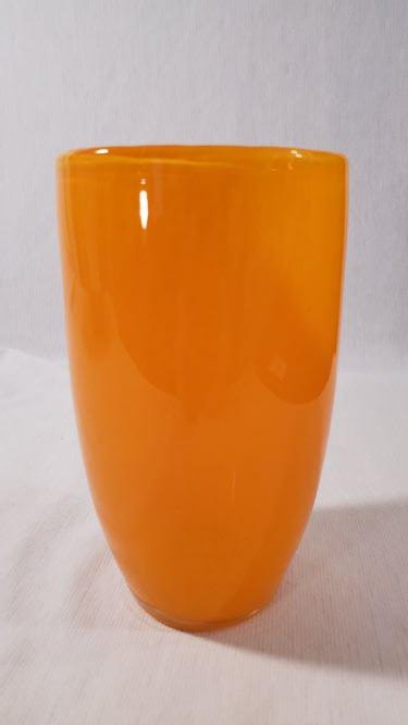 Hand Crafted Orange Art Glass Vase: Hand Crafted Orange Art Glass Vase. 5 1/2 inches tall, 3 inches at mouth 2 inches at base. Subtitle print within the glass almost looking like tortoise shell or cheetah pattern.