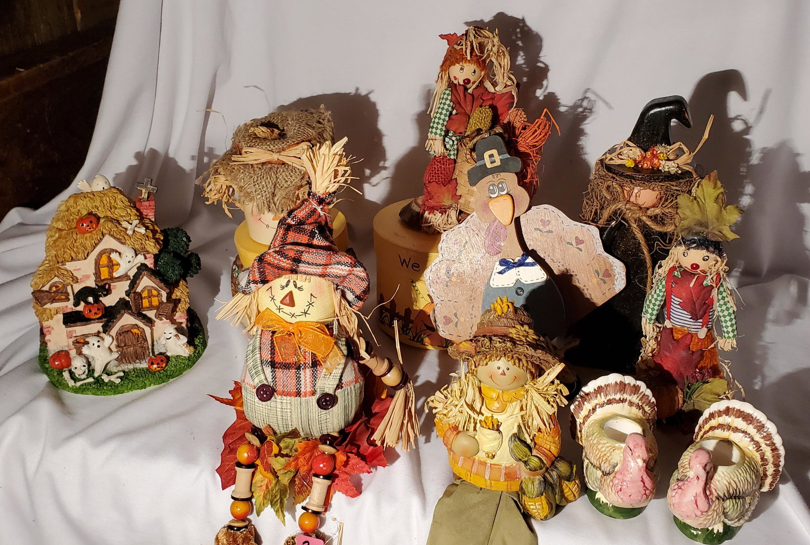 Assorted Autumn Arrangements: Assorted Halloween and Thanksgiving decorations, with turkey candleholders