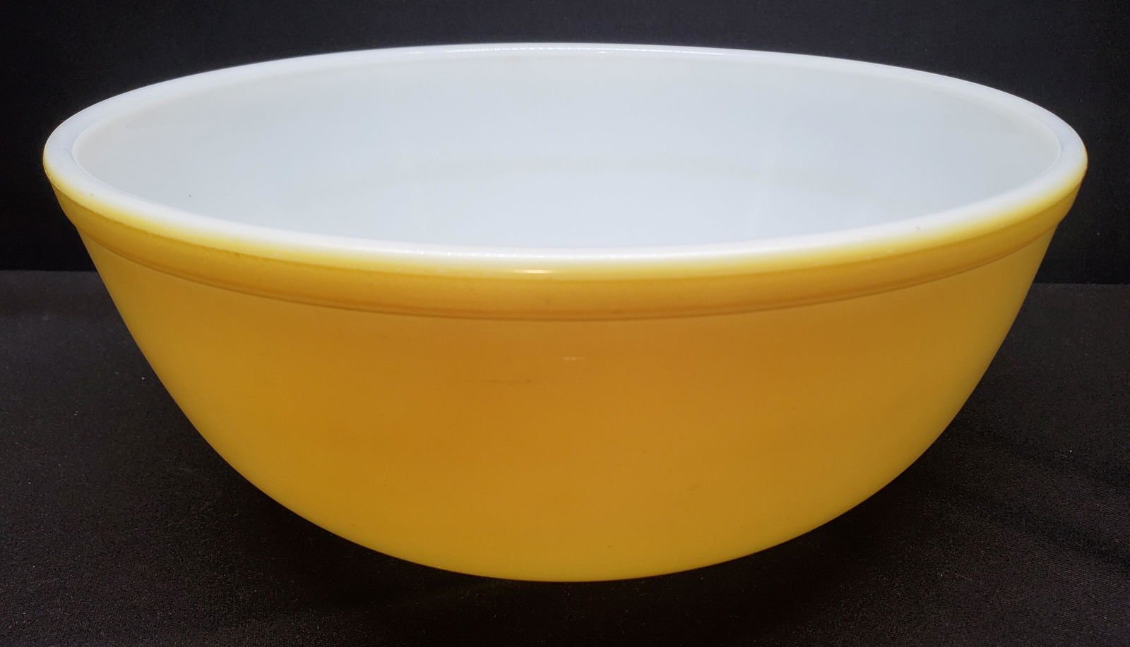 Mixing Bowl "Yellow" by Pyrex: Yellow Mixing Bowl. Width 10 1/2 inches, Height 4 1/2 inches 404 Yellow Discontinued