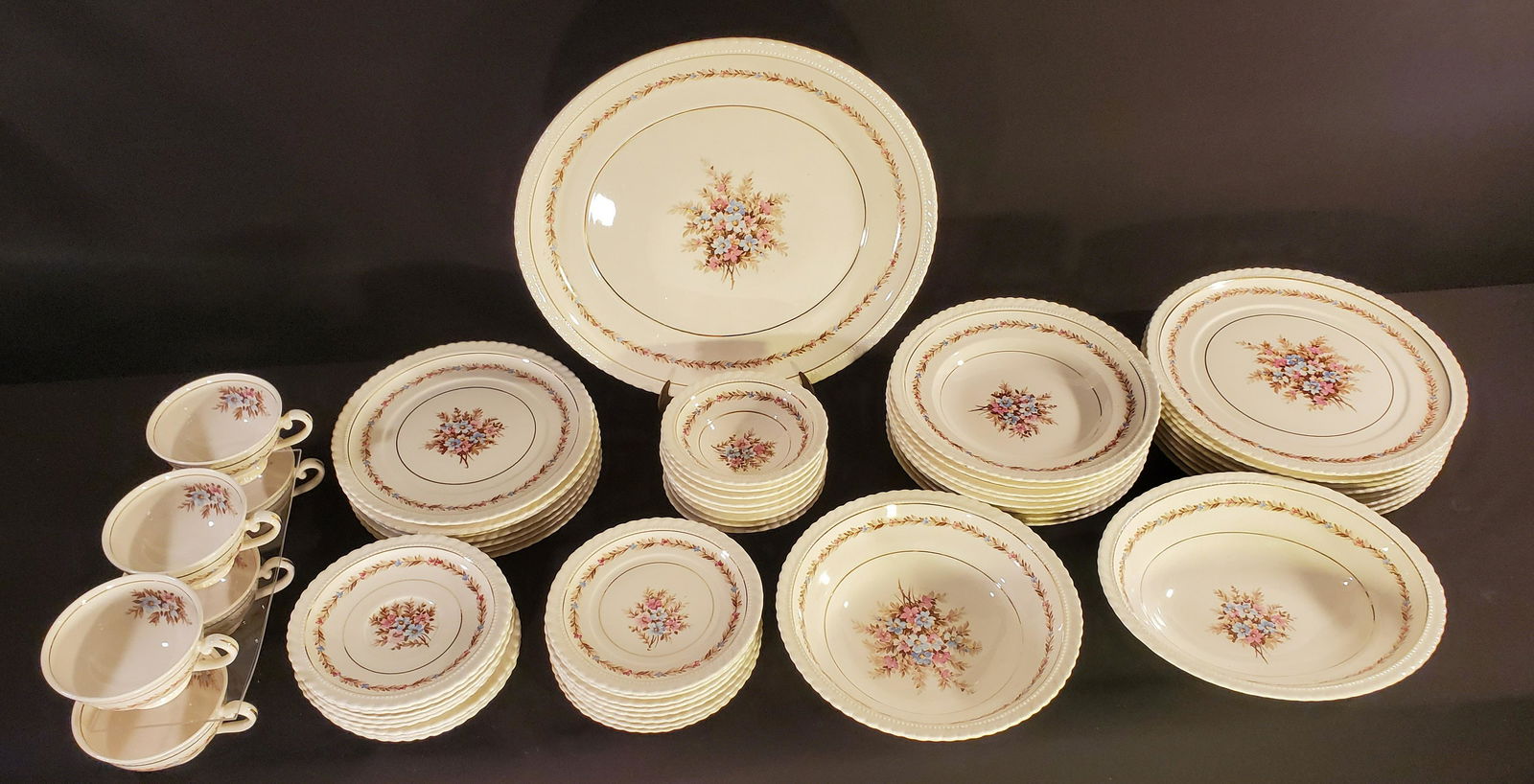 REV 3 by Regal Velvin: Pink, Blue and Yellow flowers with Gold inner ring. This set is discontinued and it includes: eight 10 inch dinner plates, one 14 inch platter, one 10 inch oval vegetable platter, one r10 inch round p