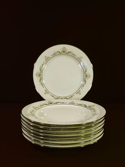 Early Spring by Noritake: Early Spring by Noritake is described as pink and yellow flowers with green scrolls. Eight 8 3/8 inches salad plates