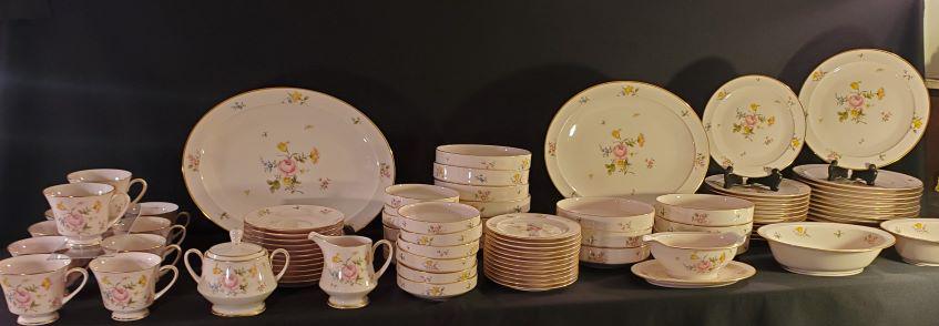 Bridal Rose by Noritake: Bridal Rose by Noritake has a pink background with pink, blue, yellow flowers. Discontinued 1974-1982 Serve for 12 include 10 3/8 dinner plate, 8 3/8 Salad plates, 6 1/4 bread, and butter plates, 5-in