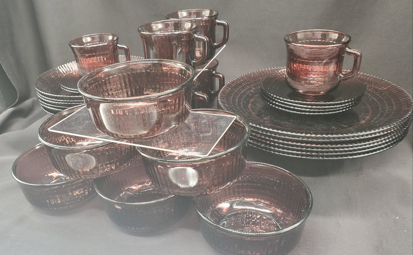 Vintage Forte Carisa Amethyst glass dishware set: Vintage Forte Carisa ribbed Mexican Amethyst glass dishware set, serves for 6, dinner plates 10inches wide, soup bowls 8.5inches wide, Cereal bowls 5x2.5inches, cups and saucers set, 30 pieces total