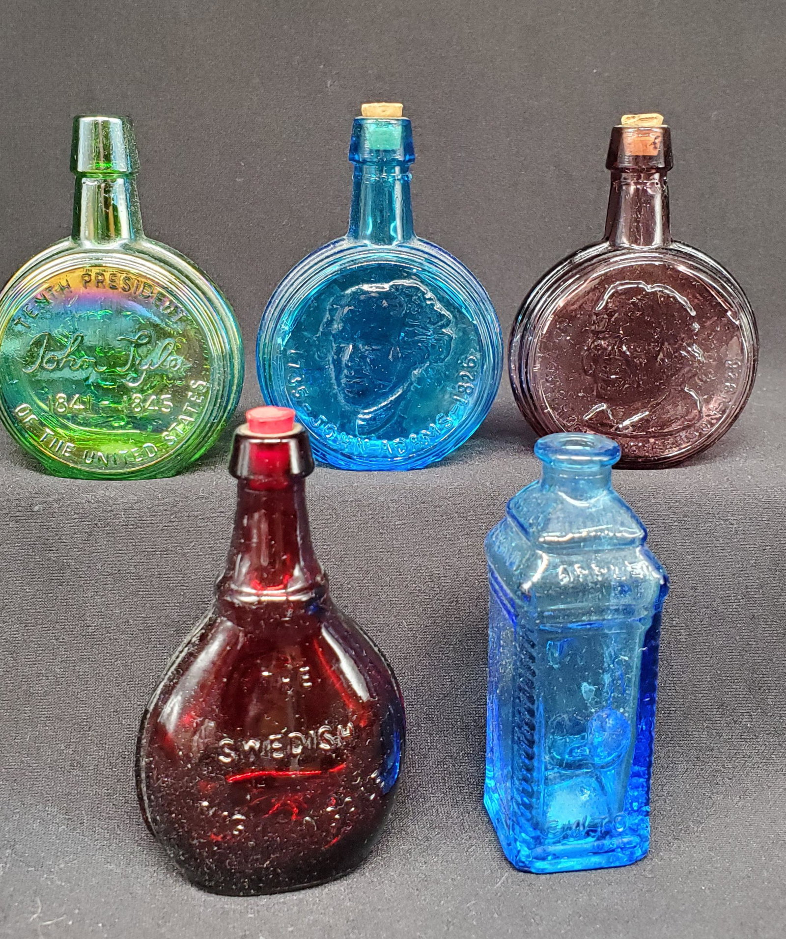 Collection of Miniature Bottles: Collection of 5 Highly Sought after collectable miniature bottle, in colored glass and carnival glass
