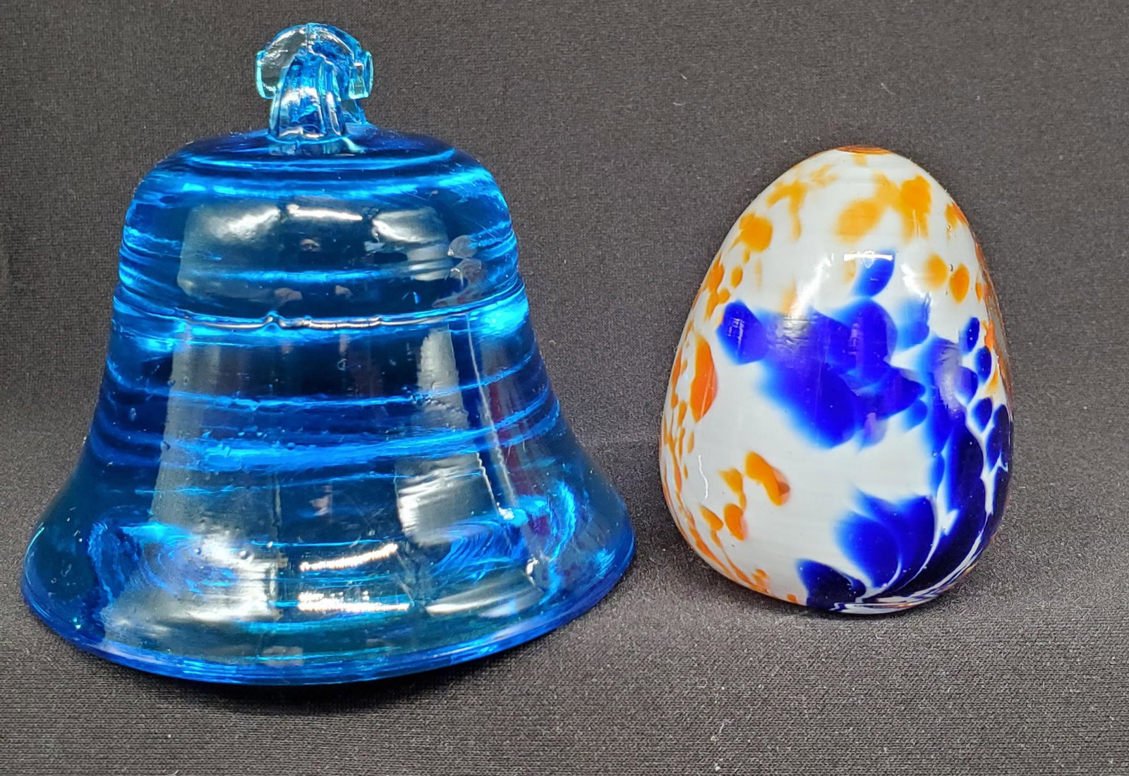 solid blue crystal bell paperweight and egg: Vibrant solid blue crystal paper weight in shape of a bell and decorative art glass egg