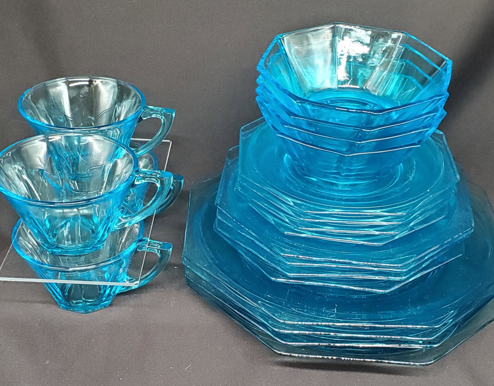 Vintage Hazel Atlas glassware set: Service for 4 Vintage Hazel Atlas glassware in Capri Blue, four dinner plates 10inches wide, four Bread and Butter plates 7.5inches wide, four bowls 4.75inches wide, four cups and saucers.