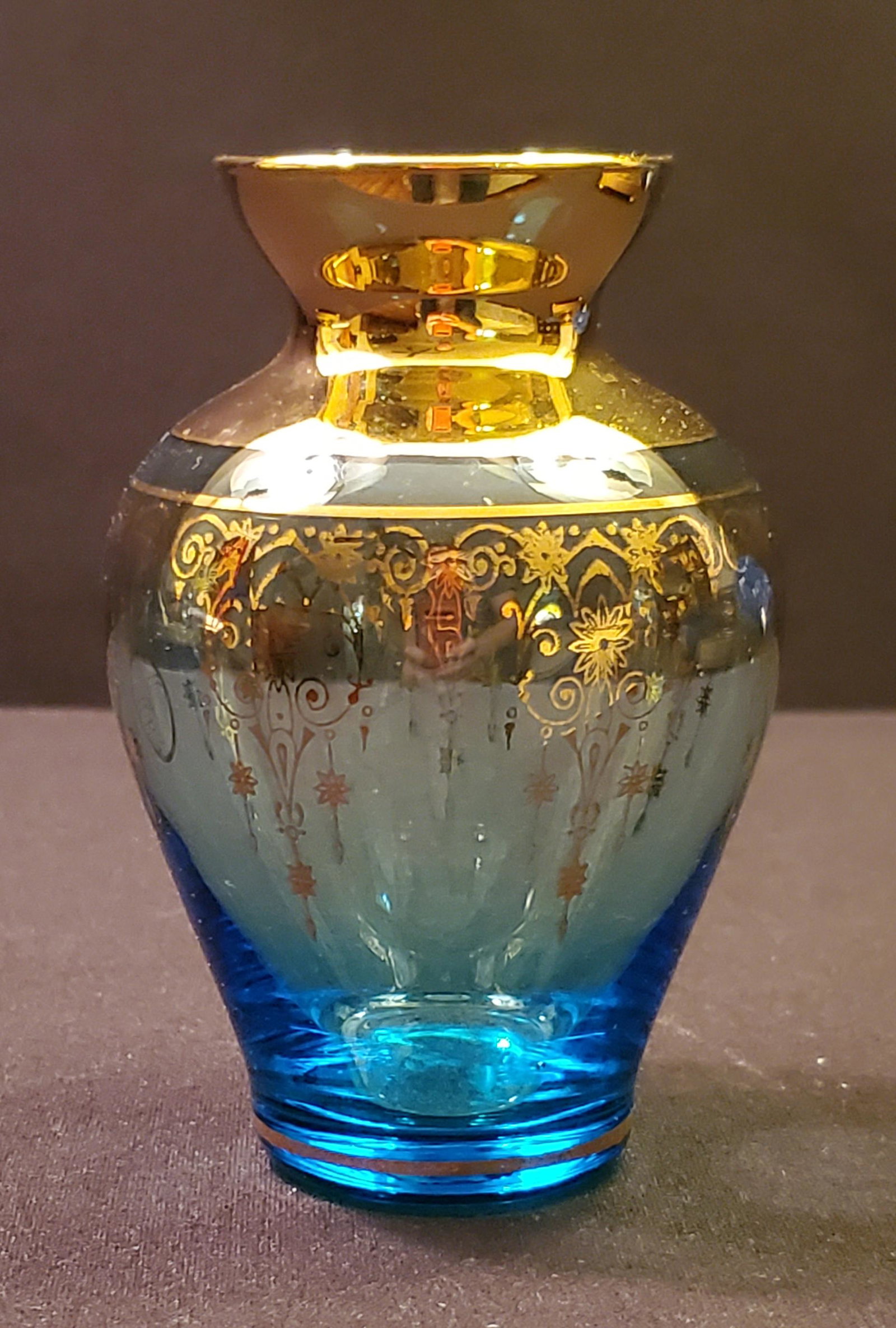 Hand Blown Iridescent Glass Vase: Vintage Small Czech Hand Blown Iridescent Glass Vase with the colors of Blue /Clear/22 KT Gold 4.5" tall with a 3" opening and 1.5" base; Unique small Czech vase. This vase is petite in size and stunn
