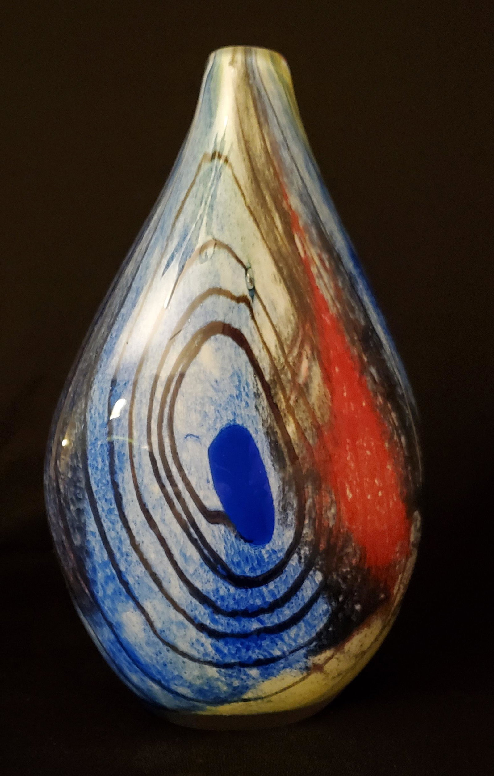 Large Thick Heavy Multi-Colored Art Glass Vase: This unique vase has colors from Blues to the Reds and yellows. 12" tall with a 1" opening and a base of 3".