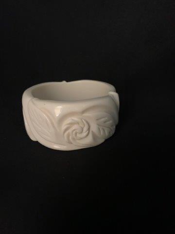 Vintage Carved Bakelite Bangle Bracelet: This off white carved Bakelite bangle is an iconic example of vintage style
