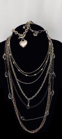 Collection of Chains & Heart Charm Bracelet: Nine piece lot. Eight neck chains and one heart charm Tiffany style bracelet. Untested and unknown materials