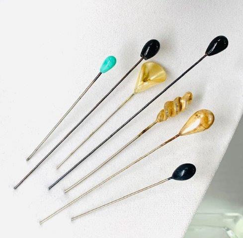 Grouping of vintage hat pins: Gorgeous collection of seven vintage hat pins or straight pins. Â Detailed glass toppers make these and awesome keepsake and or gift. Â