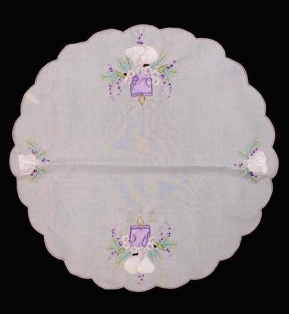 Advent table covering: Beautifully detailed table covering depicting evergreen branches and garlic cloves. Silver piping trim around scalloped edge. Sold as is.