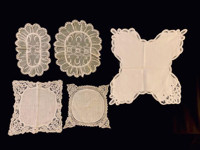 Collection of 5 Table Doilies: Beautiful assortment of lace table doilies. 1 Top left 11.5x7 inches, 2 Top row middle 13x10.5 inches, 3 Bottom left 10x11 inches, 4 bottom middle 17x17 inches, 5 right side 10x10 inches, point to poi