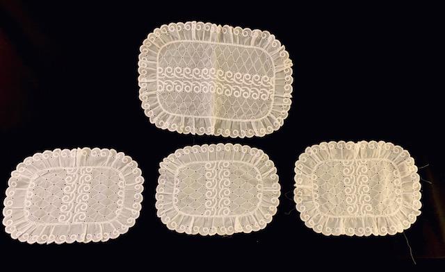 Set of 4 Doilies: 3 measuring 13.5 x10 inches, 1 measuring 17.5x12 inches. Beautifully embroidered table linens