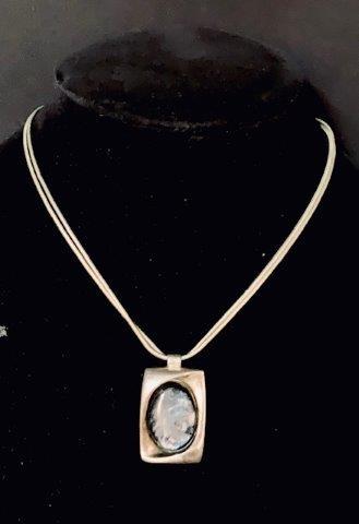 Irridescent Pendent on 800 Stand Necklace: Beautiful silver tone and abalone necklace measuring 14-19 inches in length.