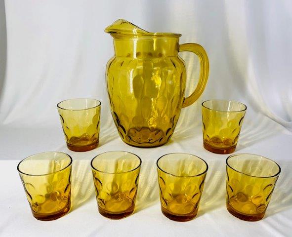 Vintage Amber Glass Beverage Set: Beautiful honey amber glass Cain Dot beverage set including 9 inch tall pitcher and 6 matching glasses 3 1/2 inches tall.