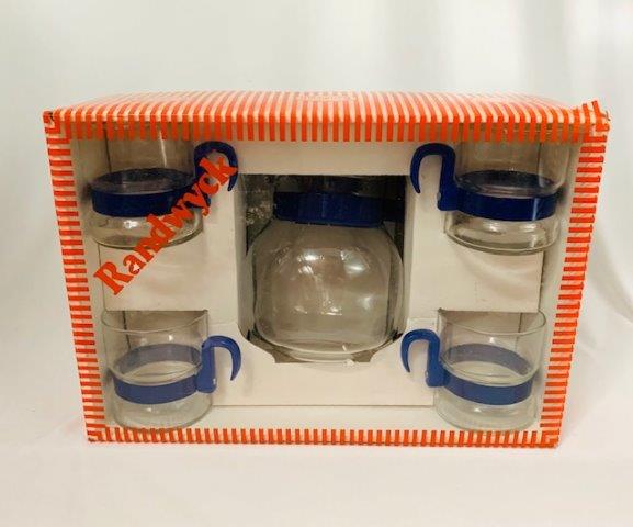 New Old Stock Randwyck Coffee Set: New mid-century merchandise. This blue-trimmed glass coffee pot has such mid-century modern Dutch charm and influence. Box still unopened. Mugs estimated at 3 inches tall and coffee pot estimated at 5