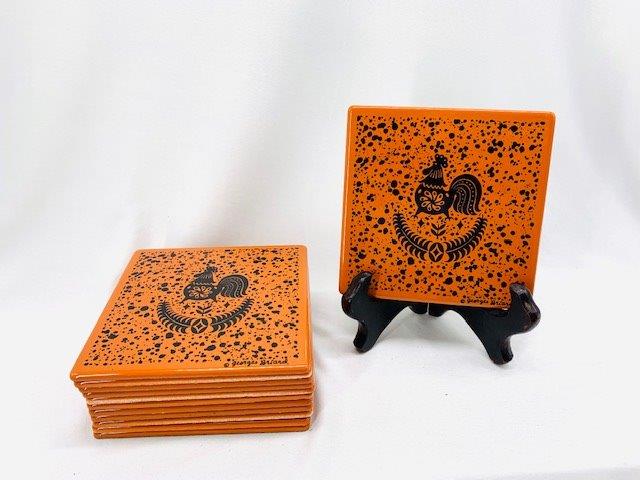 Twelve Signed Georges Briard Enamel Tiles: Burnt Siena color with rooster design on these 12 Georges Braird signed enamel tiles.