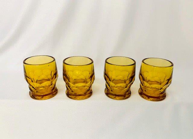 Vintage Amber Thumbprint Glass Shooters: This great set of 4 honey amber thumbprint shooters is 2 inches tall and 2 inches in diameter.