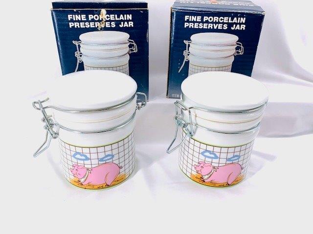Pair of Vintage Porcelain Preserves Jar: An awesome estate find, these porcelain preserve jars are brand new original box and have an adorable depiction of a pig on them.