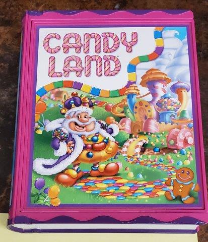 Candy Land Book Edition Board Game Classic Pre-school: Candy Land Book Edition Board Game Classic Pre-school Collection! Very Easy to play! Just pick a card and move it along the path of fun! Includes Full Size Gameboard, (4) Gingerbread Tokens and Deck o