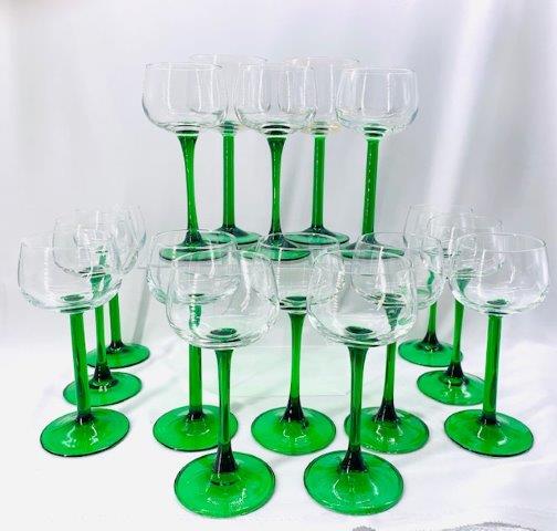Large Collection of Green Stem and Glassware: 16 piece collection, 14 white wine glasses and 2 red wine glasses.