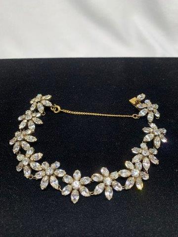 Vintage Rhinestone Floral Bracelet: Iconic vintage floral shape and exquisite craftsmanship this beautiful vintage rhinestone bracelet measures 7 inches and features of safety chain clasp.