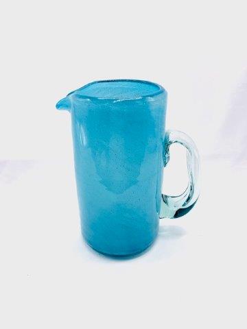 Hand Blown Textured Blue Picture: Beautiful hand blown textured glass pitcher standing 8 1/2 inches tall with clear handle.