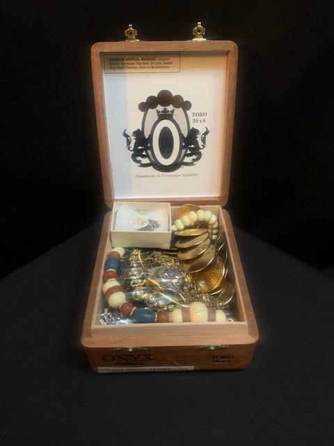 Cigar box filled with costume jewelry: Cigar box filled with costume jewelry Assorted styles colors and designs All items not inspected or tested