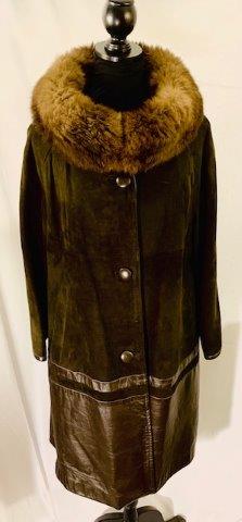Vintage Leather Coat with Fur Collar: Unique ladies coat suede on the top with leather on the bottom soft fur color possibly rabbit. No damage or flaws to note this lot as well as the other coats in this auction , comes from an exceptiona