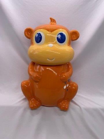 Cheeky Orange Monkey Cookie Jar: Hilarious and cheeky orange monkey cookie jar measuring 12 inches tall.