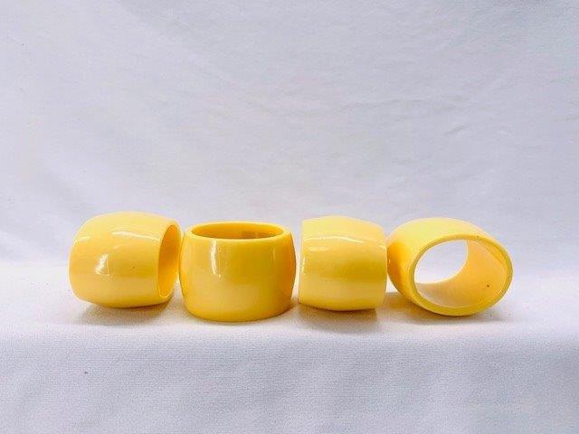 Vintage Bakelite? Napkin Rings: Set of four yellow vintage Bakelite? napkin rings in mint condition.