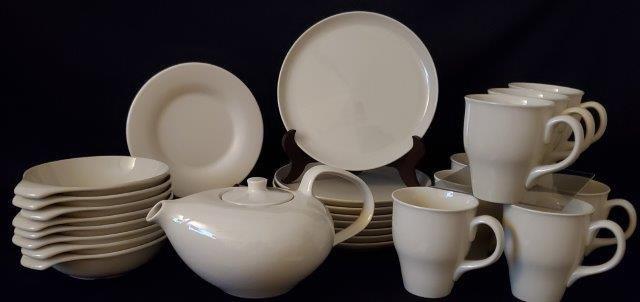 Russel Wright Dishware - Servicer for 8: Classic Mid Century Style with this set of Russel Wright dishes for Oneida in Linen CrÃ¨me. Off White Stoneware in sleek design. Service for 8 and includes often hard to find teapot and soup bowls!
