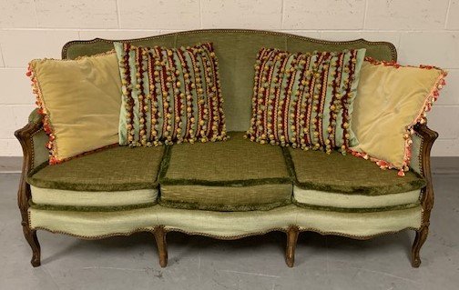 Vintage Two-Tone Upholstered Sofa: This Vintage two-tone upholstered sofa itâ€™s simply stunning with its two-tone green design and thick plush cushions complete with nail head trim detail. It features carved wooden legs and comes