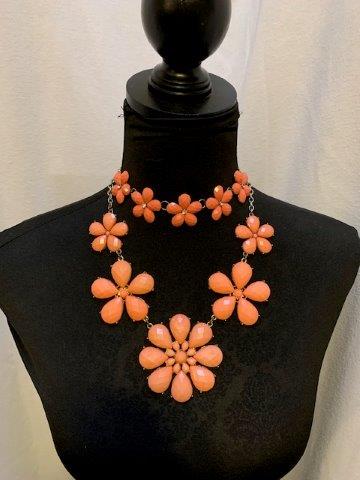Peach Daisy Pairing: Lovely pairing of two necklaces. A perfect mother/daughter gift idea. The smaller floral measuring 12-18 inches in length and the larger 14-18 in length.