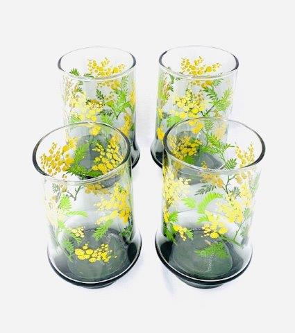 Vintage Footed Smoked Glass Floral Tumblers - Set of 4: Lovely set of four footed tumblers. Yellow and green floral design measuring five inches tall.