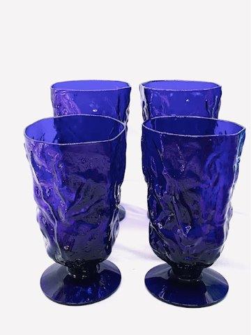 Set of Four Cobalt Blue Pedestal Water Goblets: Deep cobalt blue textured glass pedestal water goblets. Set of 4.