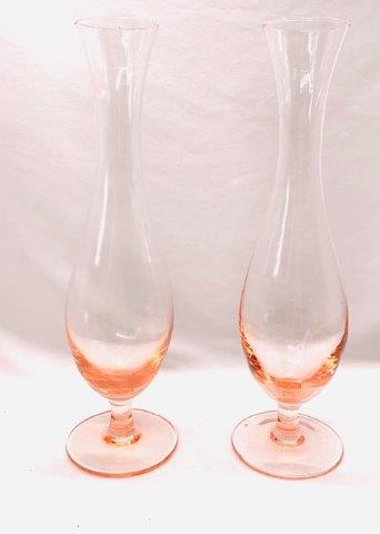 Pair of Pale Pink Bud Vases: Lovely and romantic are these two matching pink glass bud vases measuring 7 inches tall.