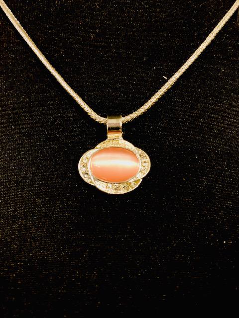 Pink Moonstone Cabochon Necklace: Lovely 16 inch pink moonstone cabochon pendant necklace surrounded by cubic zircon chip. All Items generally inspected during cleaning for damage etc. All items are in good wearable/sellable condition