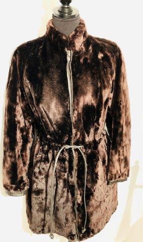 Sensational Vintage Genuine Ladies Seal Fur Coat by Lee: A stunning deep chocolate lush soft coat. This piece is exceptional. Patterned interior lining is also in exceptional conditional. Zippered front with built in leather cinch belt at waist and black le