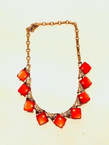 Silvertone and Pomegranite Lucite Necklace Signed Coro: Beautiful coloration. Signed Coro. Measures 14 inches in length. All Items generally inspected during cleaning for damage etc. All items are in good wearable/sellable condition unless otherwise noted.