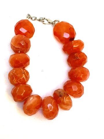 Raw Faceted 476 Carat Carnelian Bracelet: Simple and beautifully gritty, this 476 carat carnelian stone bracelet defines a "Statement Piece"