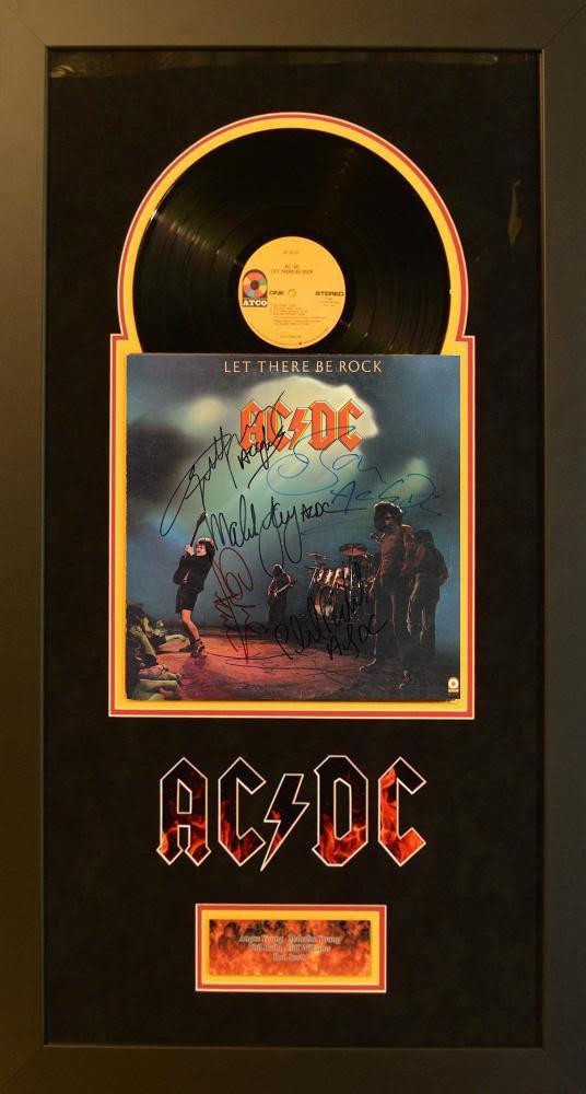AC/DC Signed & Framed Let There Be Rock Album: AC/DC Signed & Framed Let There Be Rock Album. Signed by Bon Scott, Angus Young, Malcolm Young, Cliff Williams, and Phil Rudd. This item comes with a Certificate of Authenticity from a third party aut