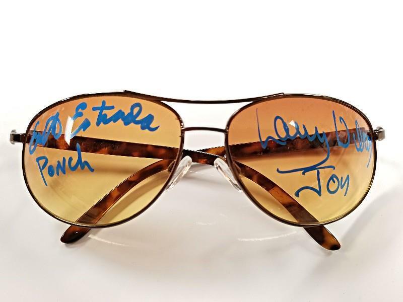 Erik Ponch Chips and Wilcox signed Sunglasses- PSA: Signed by Erik "Ponch" Estrada and Larry Wilcox. This Item comes PSA Authenticated. This item comes with a Certificate of Authenticity from a third party authenticator. This Certification of Authentic