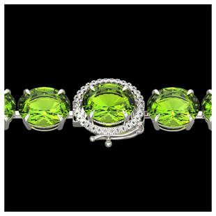 67 ctw Peridot & VS/SI Diamond Bracelet 14K White Gold: 67 ctw Peridot & VS/SI Diamond Bracelet 14K White Gold Designer Brand Luxury Jewelry, made in the USA Suggested Retail Price: $30,650 Factory offers perfect factory sizing, for all rings &